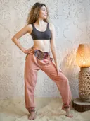 Штаны розовые с разноцветными полосками.